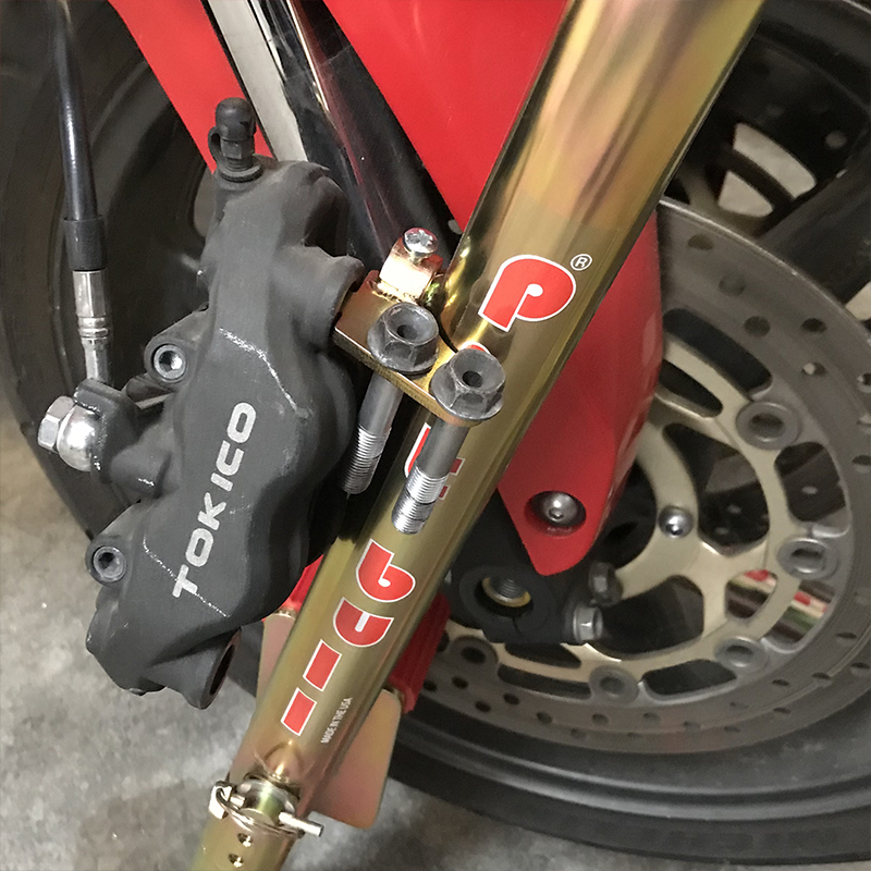 Motorcycle stand brake caliper holders